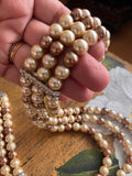 Bracciale di fili di perle decorative color avorio, champagne e rosa antico
